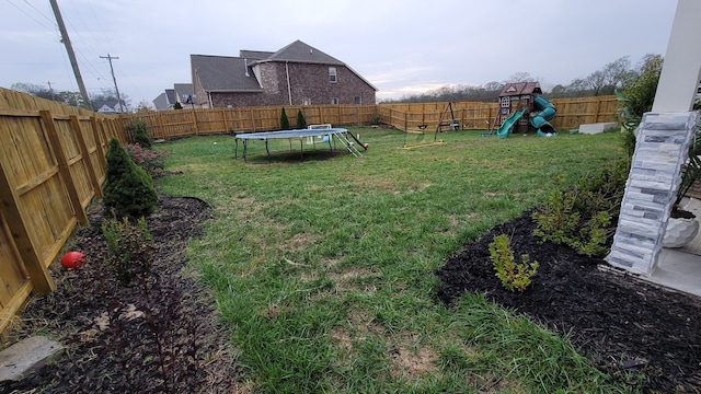 view of yard featuring a trampoline