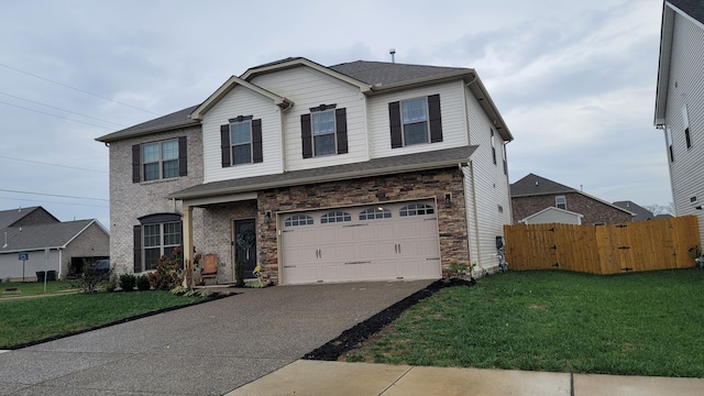 view of front of house featuring a garage and a front yard