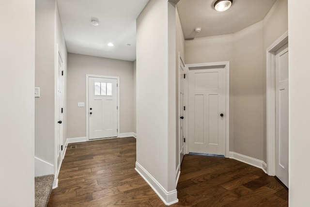 foyer entrance with dark wood-type flooring