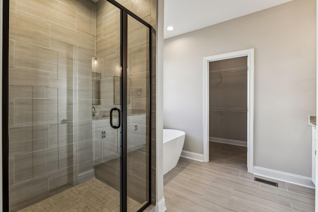 bathroom featuring plus walk in shower