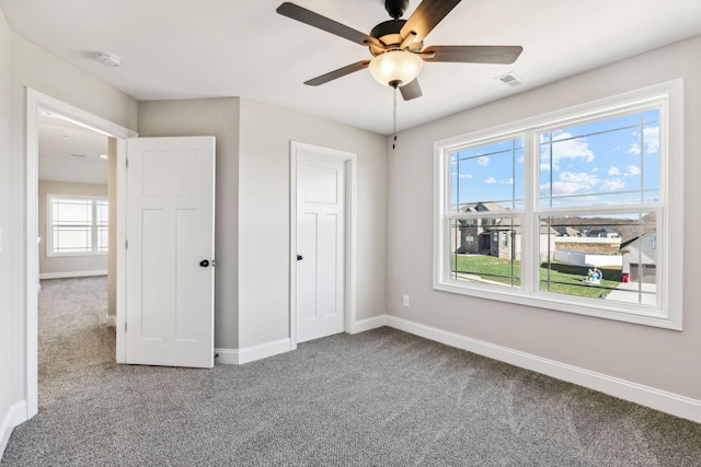 unfurnished bedroom with carpet flooring and ceiling fan