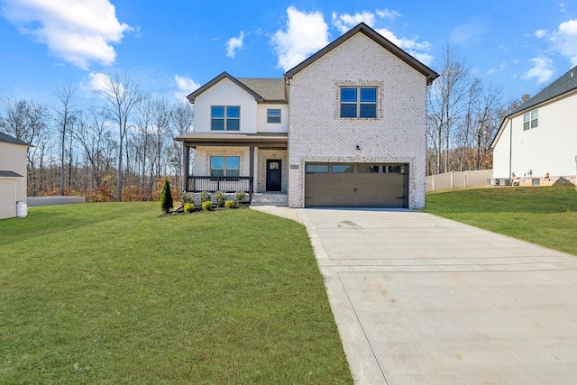 view of front facade with a porch, a garage, and a front yard