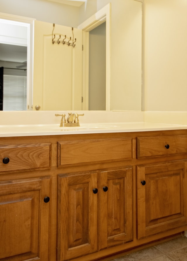 bathroom featuring tile patterned floors and vanity