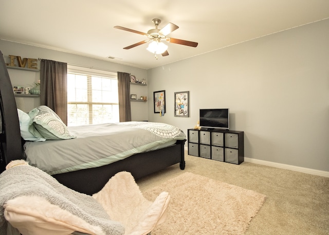 bedroom with ceiling fan and light colored carpet