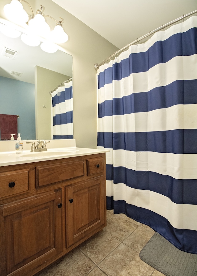 bathroom featuring tile patterned floors and vanity