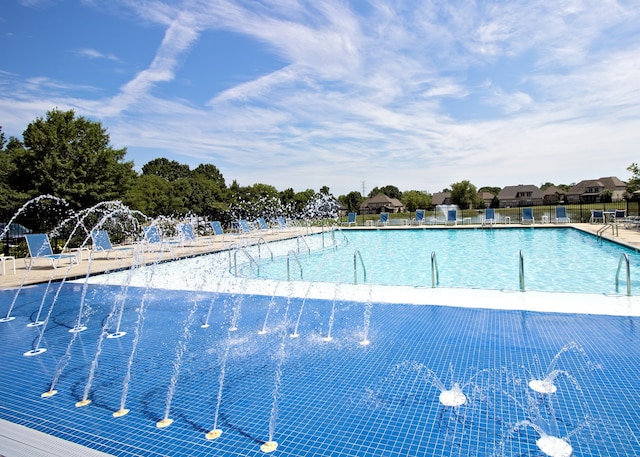 view of pool with pool water feature