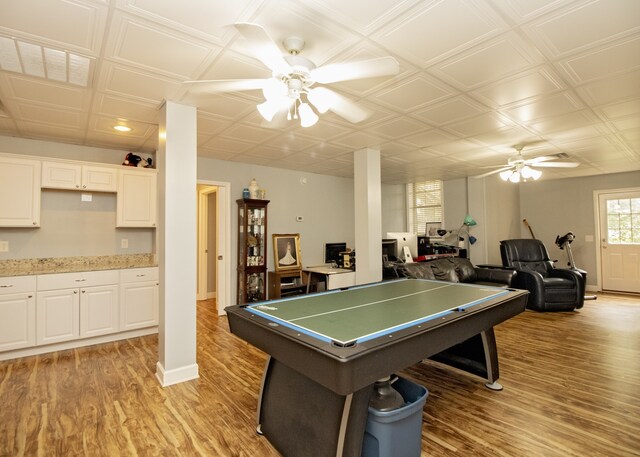 playroom featuring ceiling fan and light hardwood / wood-style flooring