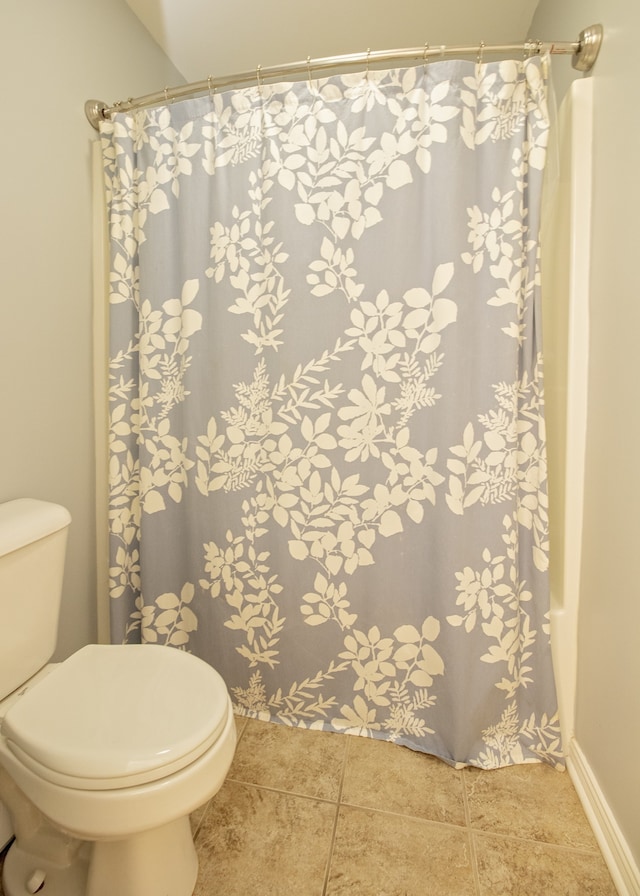 bathroom featuring tile patterned flooring and toilet