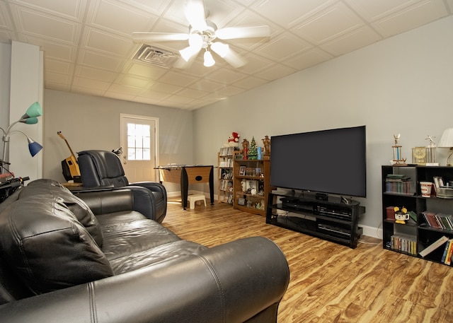 living room featuring ceiling fan and light wood-type flooring