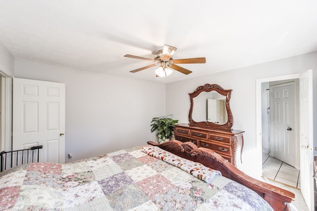 bedroom featuring ceiling fan and tile patterned flooring