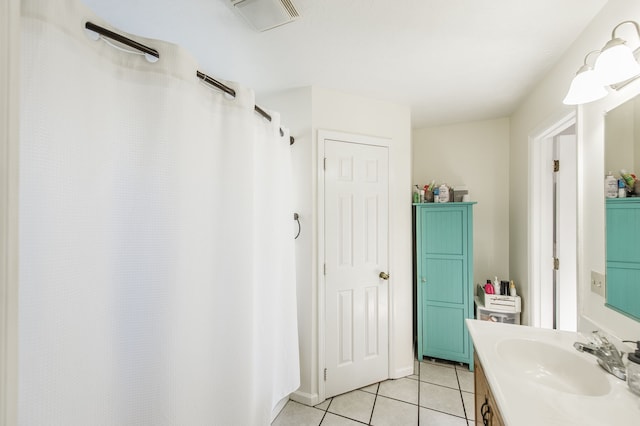 bathroom with vanity and tile patterned floors