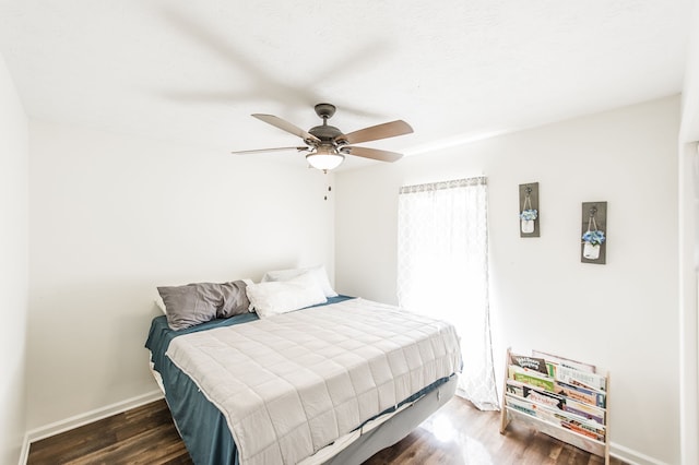 bedroom featuring dark hardwood / wood-style flooring and ceiling fan