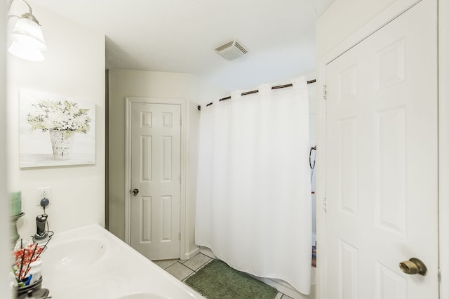 bathroom featuring vanity and tile patterned flooring