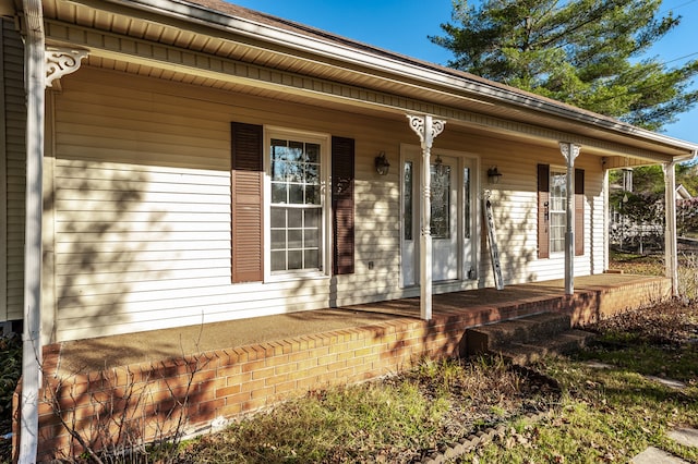 property entrance featuring covered porch