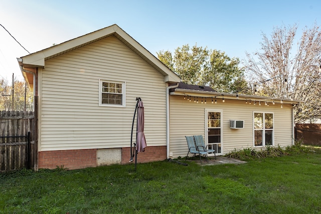 back of house with a yard