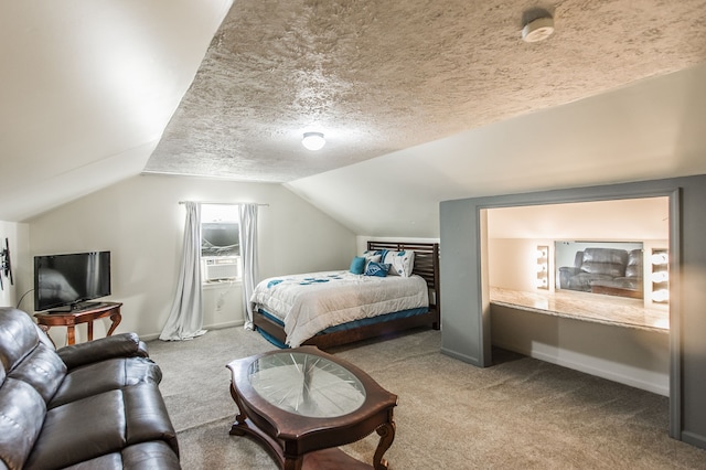 carpeted bedroom with cooling unit, vaulted ceiling, and a textured ceiling