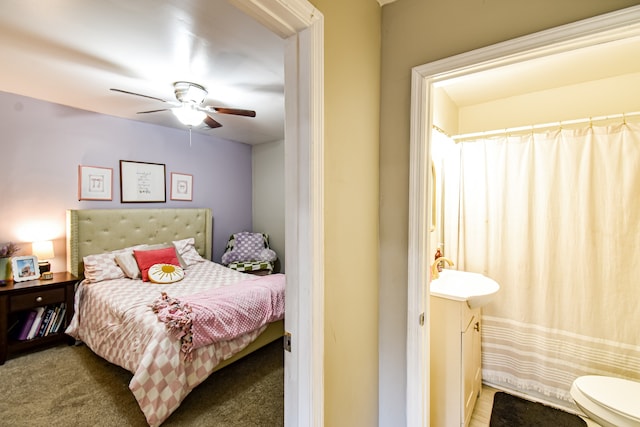 bedroom featuring ceiling fan, sink, and carpet