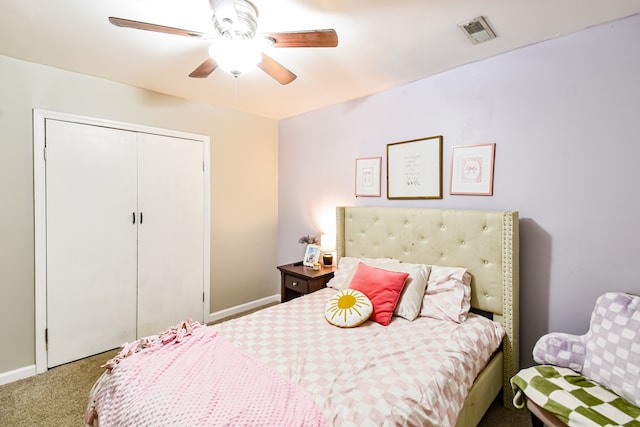 carpeted bedroom with ceiling fan and a closet