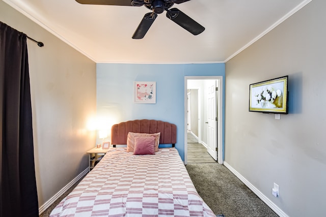 bedroom with ornamental molding, dark carpet, and ceiling fan