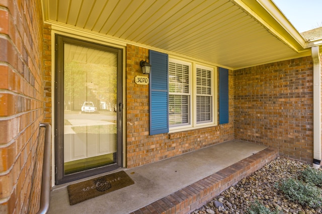 property entrance with covered porch