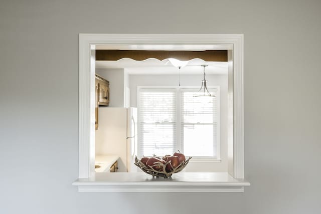 interior details featuring white fridge