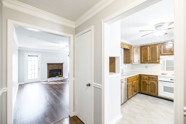 kitchen featuring white range oven, ornamental molding, a textured ceiling, dishwasher, and light hardwood / wood-style flooring