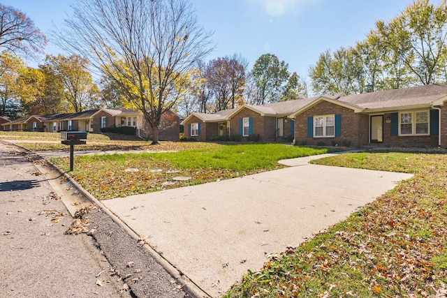 single story home featuring a front yard