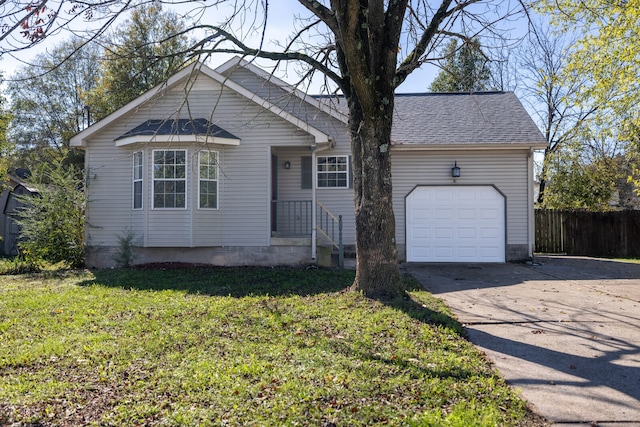 view of front of property with a garage and a front yard