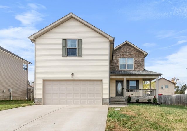 front of property with covered porch, a garage, and a front lawn