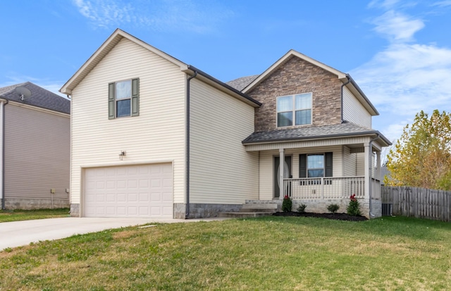 view of front of property with a porch, a garage, and a front lawn