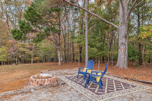 view of yard with an outdoor fire pit