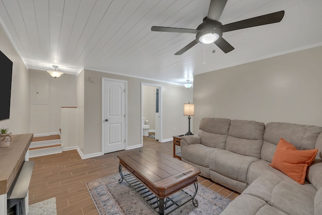 living room featuring ceiling fan, wood ceiling, light wood-type flooring, and crown molding