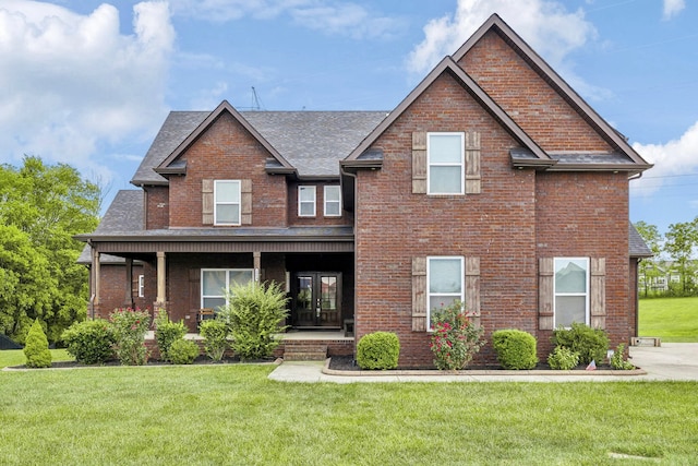 craftsman inspired home with covered porch and a front lawn