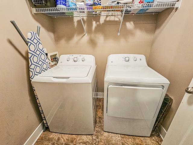 washroom with washer and dryer