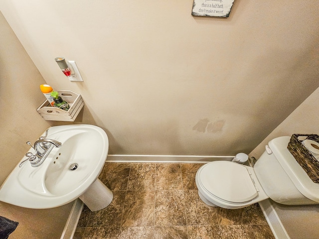 bathroom with toilet and sink