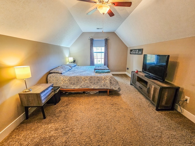 bedroom featuring lofted ceiling, a textured ceiling, carpet flooring, and ceiling fan