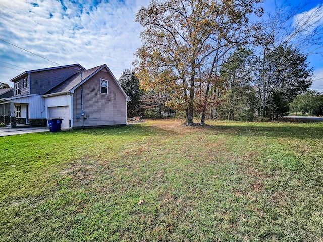 view of yard featuring a garage