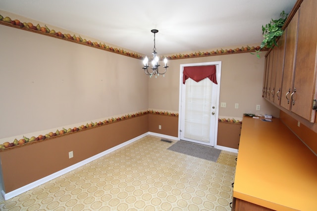 interior space featuring an inviting chandelier