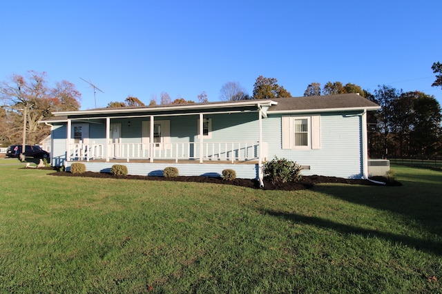 single story home with a porch and a front lawn