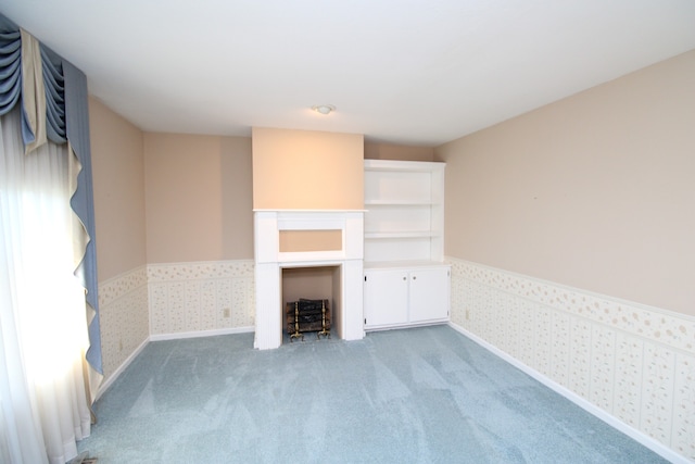 unfurnished living room with light carpet