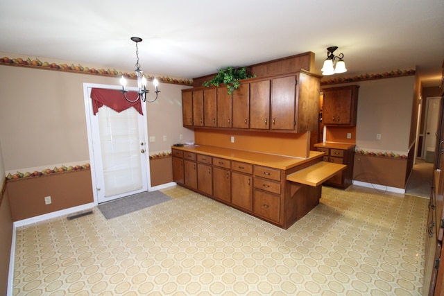 kitchen featuring a chandelier and pendant lighting