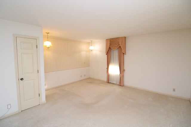 empty room featuring light carpet