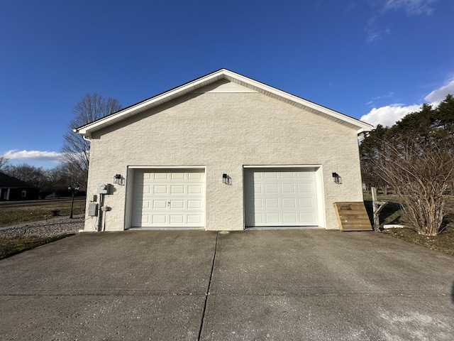 view of property exterior featuring a garage