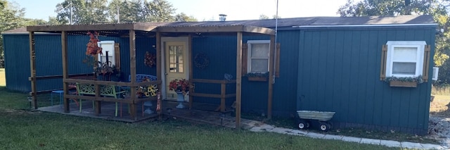 view of outdoor structure with a lawn