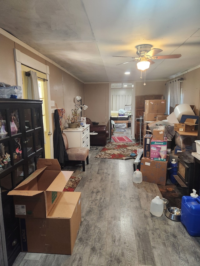 misc room with wood-type flooring and ceiling fan