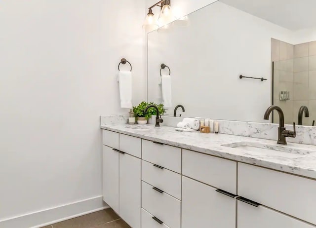 bathroom with vanity and tile patterned flooring