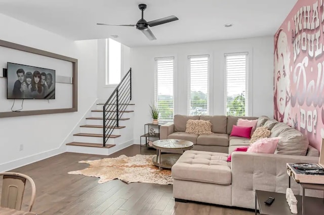 living room with dark wood-type flooring and ceiling fan