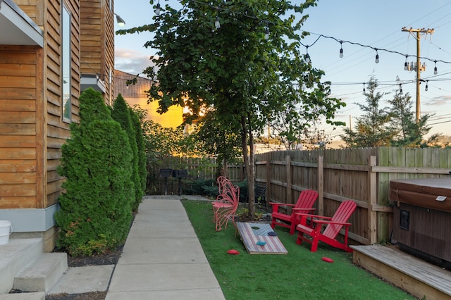 view of yard at dusk