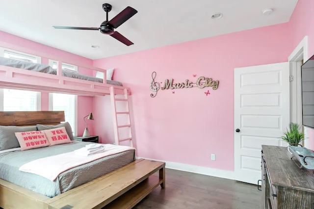 bedroom featuring dark hardwood / wood-style flooring and ceiling fan