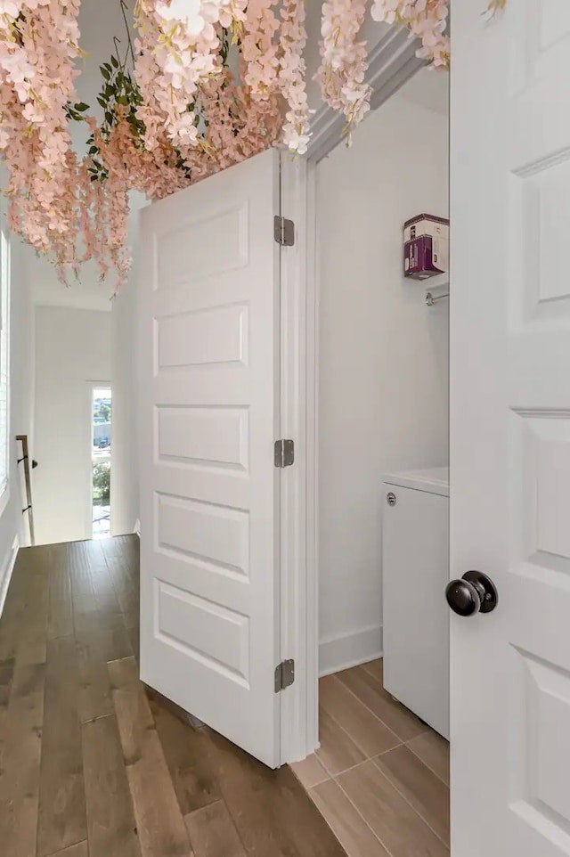 corridor featuring hardwood / wood-style floors